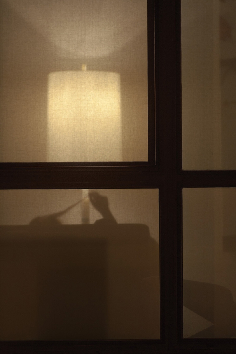 A photographer secretly watching his housemates and removes them