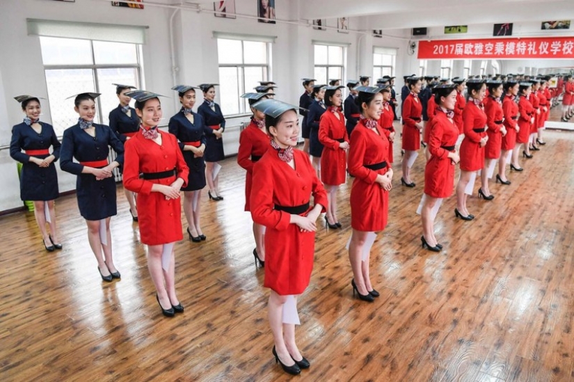 Chinese flight attendants are taught to smile, walk, stand and sit Chinese flight attendants are taught to smile, walk, stand and sit