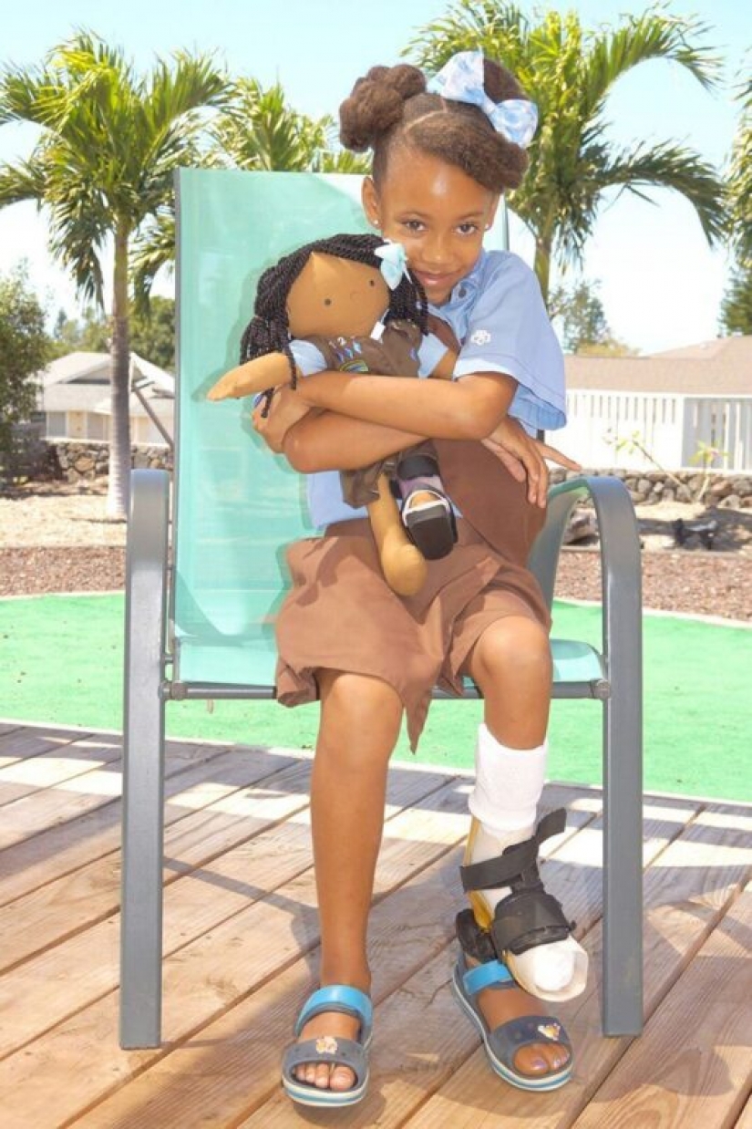 Woman sews a special doll for children with disabilities