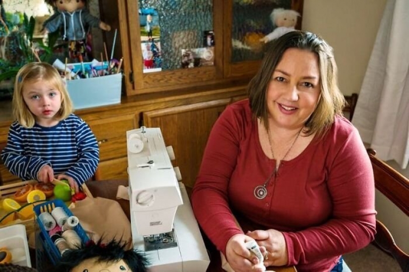 Woman sews a special doll for children with disabilities