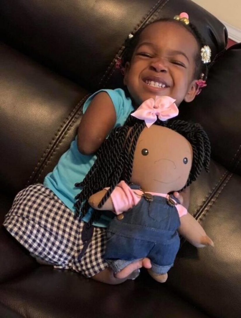 Woman sews a special doll for children with disabilities