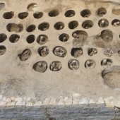 A mass grave with thousands of twisted skeletons in small niches has been discovered in Japan