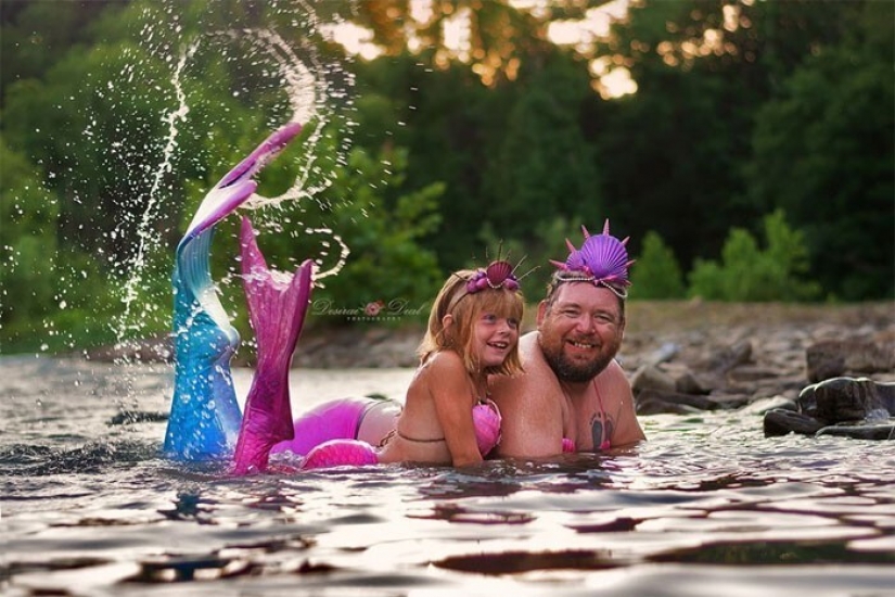 A photo shoot of a father with a little daughter in the image of mermaids conquered social networks