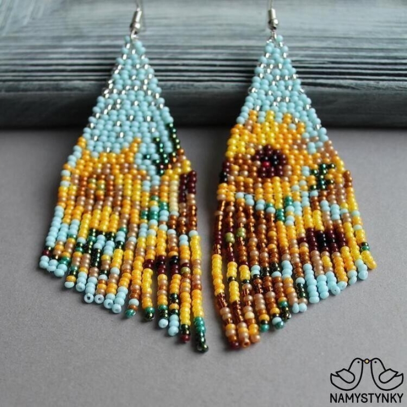 A talented Ukrainian woman makes beaded earrings based on the plots of famous paintings