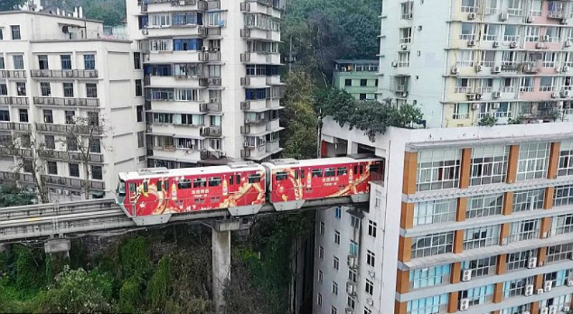 In China, a train passes right through a residential building In China, a train passes right through a residential building