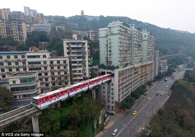 In China, a train passes right through a residential building In China, a train passes right through a residential building