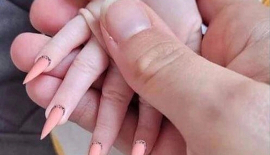 Mother accused in the brutal treatment of the child for extended nails young daughter