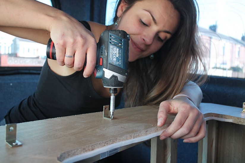 The girl has converted an old van into a motorhome and travels the world with his dog