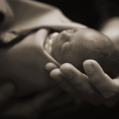 Why do people show the world photos of their dead children and why they should not be condemned