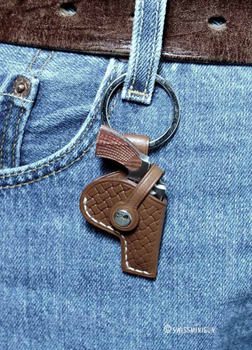 Yes, he's shooting! The smallest combat revolver was made in Switzerland