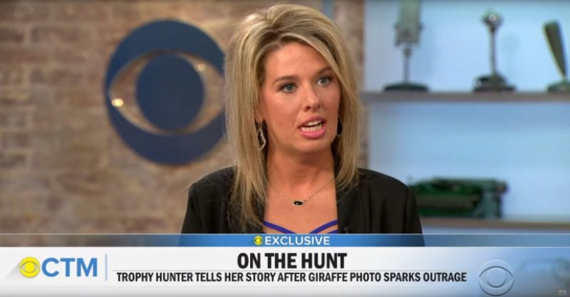 A bloodthirsty huntress killed a rare black giraffe and sewed a holster from its skin