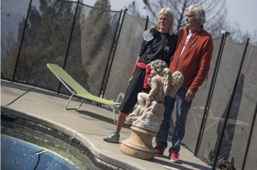 A couple from California escaped from a fire after sitting in a pool for six hours