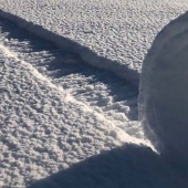 A rare natural phenomenon was observed on the field in the UK — snow rolls