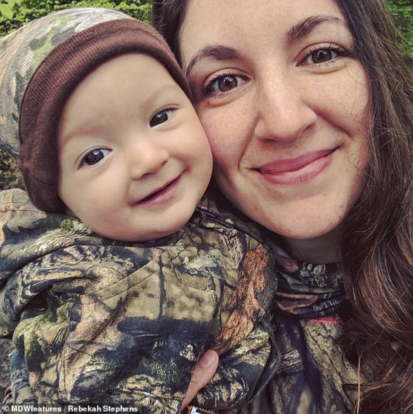 Basic instinct: a mother goes hunting with a 9-month-old baby behind her back