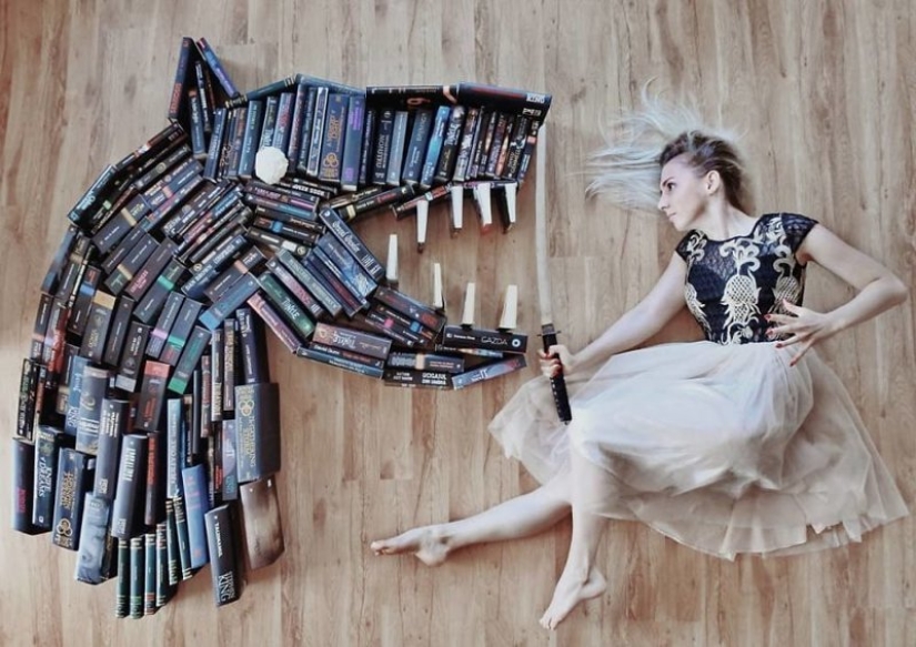 Books as art: a girl puts out colorful installations from her library