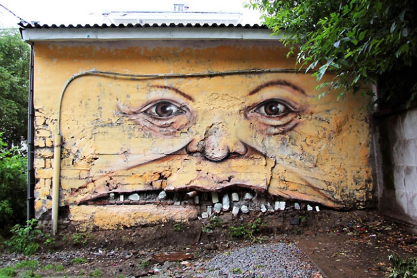 Caras en edificios por Nikita Nomerz