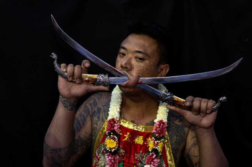 Extreme piercings put devotees in soul-cleansing trance at Thai festival Extreme piercings put devotees in soul-cleansing trance at Thai festival