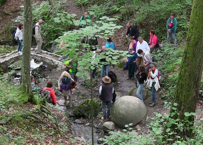 Huge stone ball in the middle of the forest