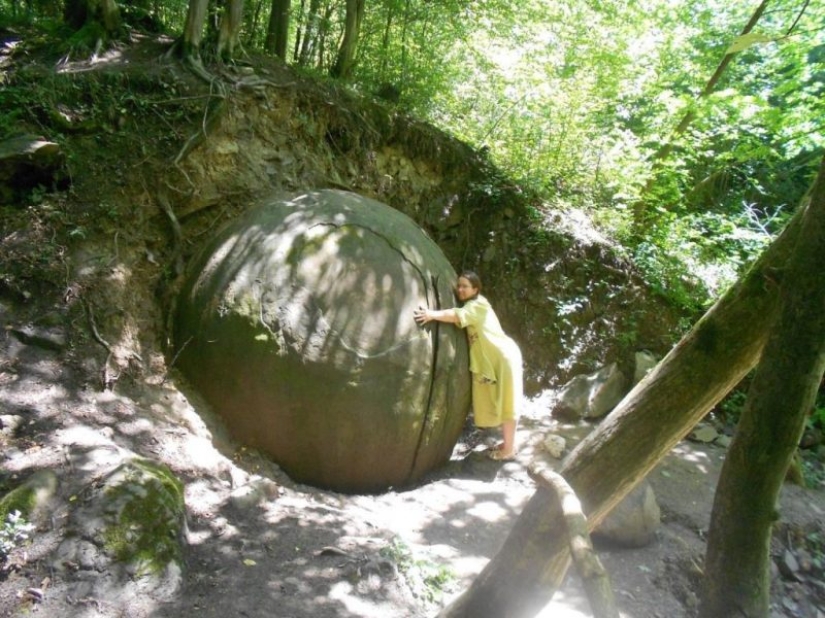 Huge stone ball in the middle of the forest