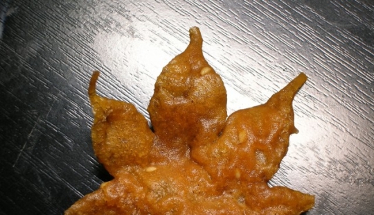 Leaves of maple in a deep fryer