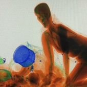 Trust, but check: the Chinese woman was so worried about her bag that she climbed into the luggage scanner for it