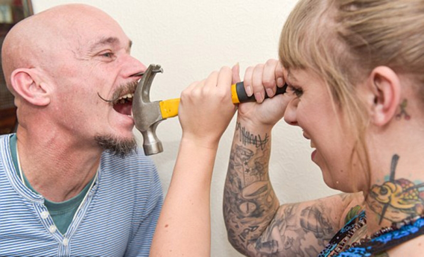 A British woman dropped out of university for a circus performance where she drives nails into her father's nose A British woman dropped out of university for a circus performance where she drives nails into her father's nose