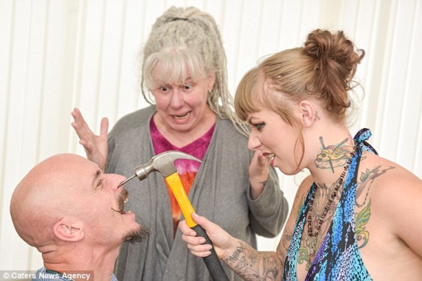 A British woman dropped out of university for a circus performance where she drives nails into her father's nose A British woman dropped out of university for a circus performance where she drives nails into her father's nose