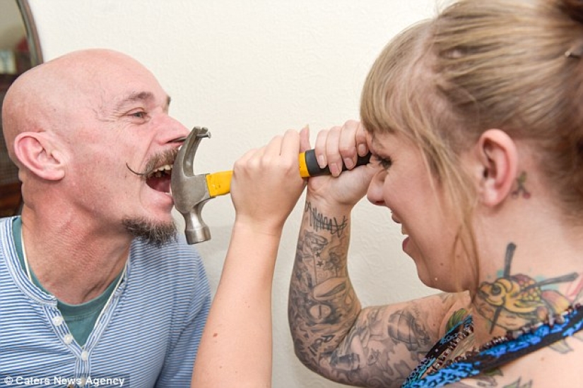 A British woman dropped out of university for a circus performance where she drives nails into her father's nose A British woman dropped out of university for a circus performance where she drives nails into her father's nose