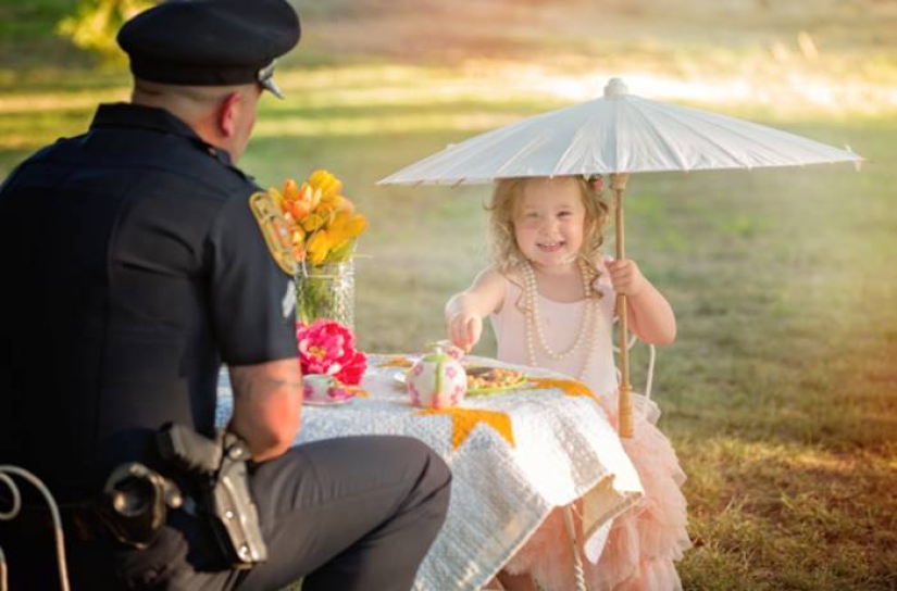 A policeman starred in a cute photo shoot with a girl he saved from death A policeman starred in a cute photo shoot with a girl he saved from death