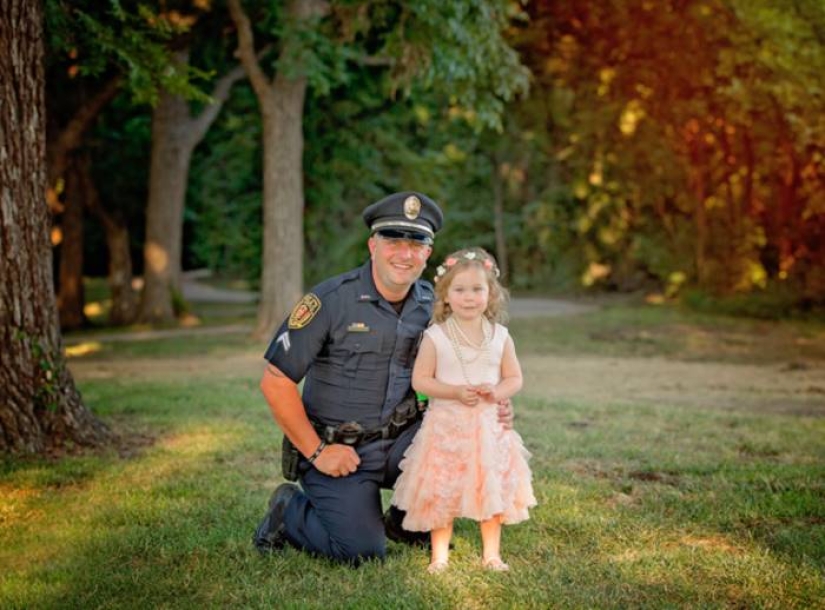 A policeman starred in a cute photo shoot with a girl he saved from death A policeman starred in a cute photo shoot with a girl he saved from death