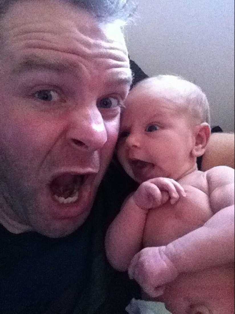 Apple from an apple tree: a young father is photographed with a newborn daughter