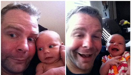 Apple from an apple tree: a young father is photographed with a newborn daughter