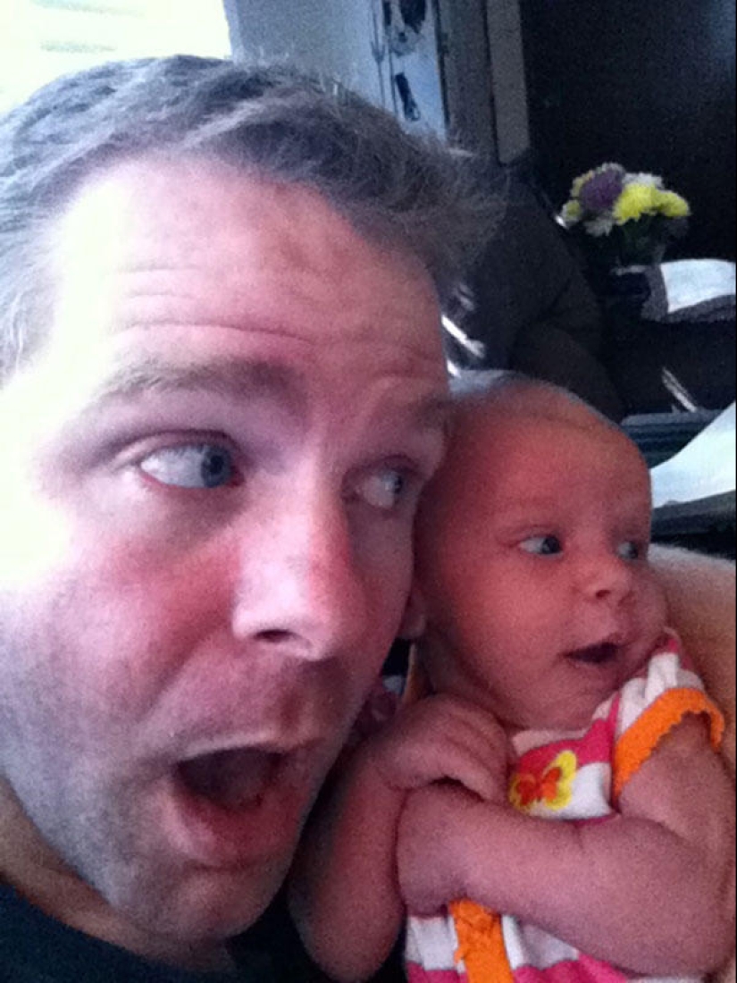 Apple from an apple tree: a young father is photographed with a newborn daughter