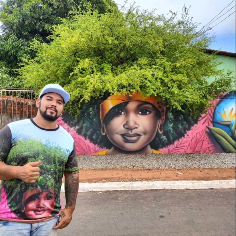 Artista callejero continúa pintando retratos en paredes junto a árboles que también sirven como cabello Artista callejero continúa pintando retratos en paredes junto a árboles que también sirven como cabello