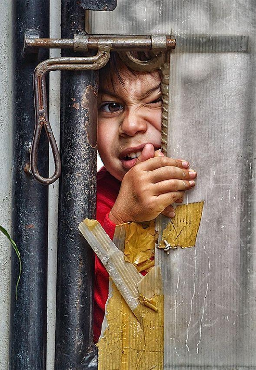 Childhood in the frame: dad takes a picture of his son