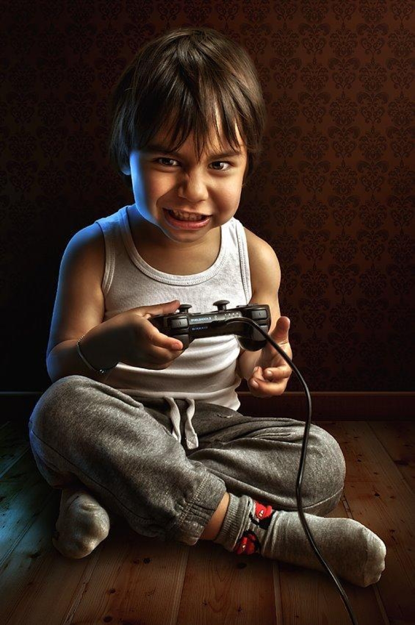 Childhood in the frame: dad takes a picture of his son