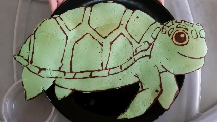 Creative dad bakes fantastic colorful pancakes for his child