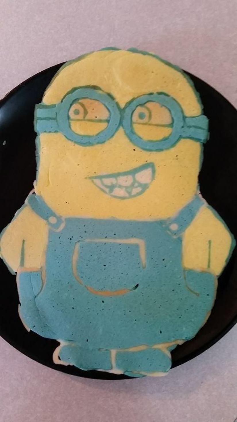 Creative dad bakes fantastic colorful pancakes for his child