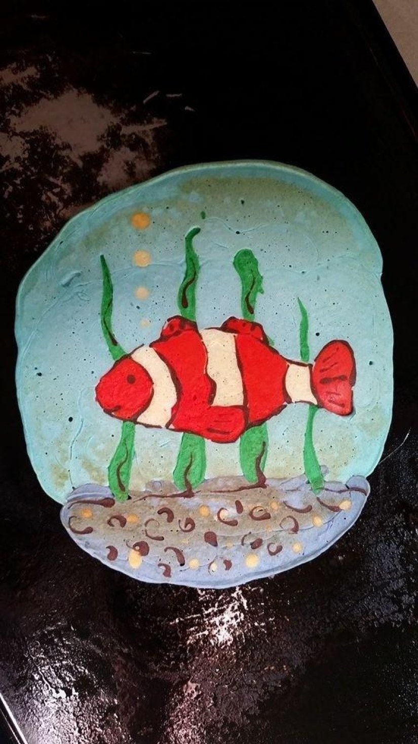 Creative dad bakes fantastic colorful pancakes for his child