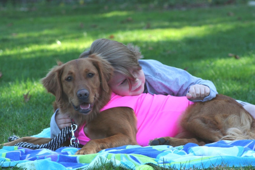 Dog Ricochet surfs with sick people and helps them recover