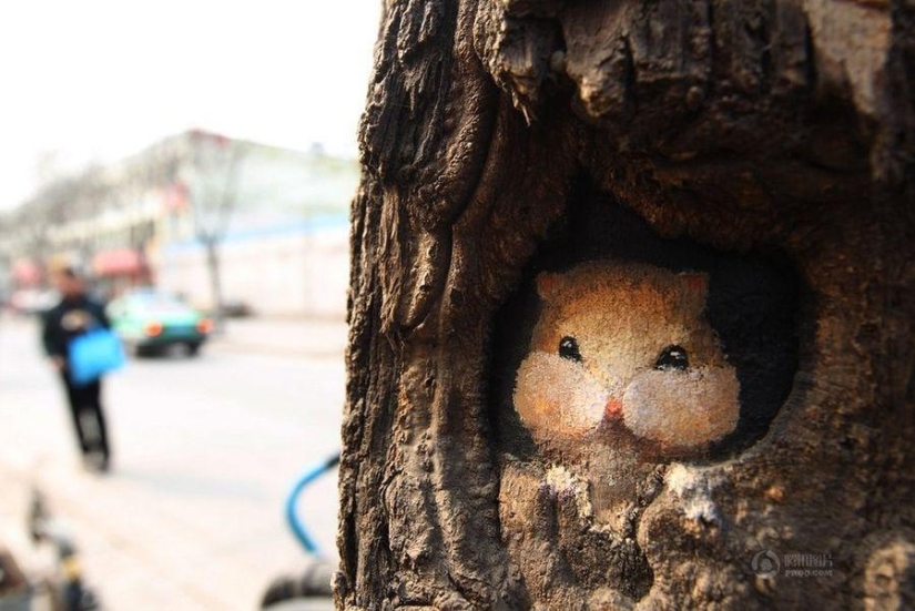 Drawings on the trees cheer up the townspeople