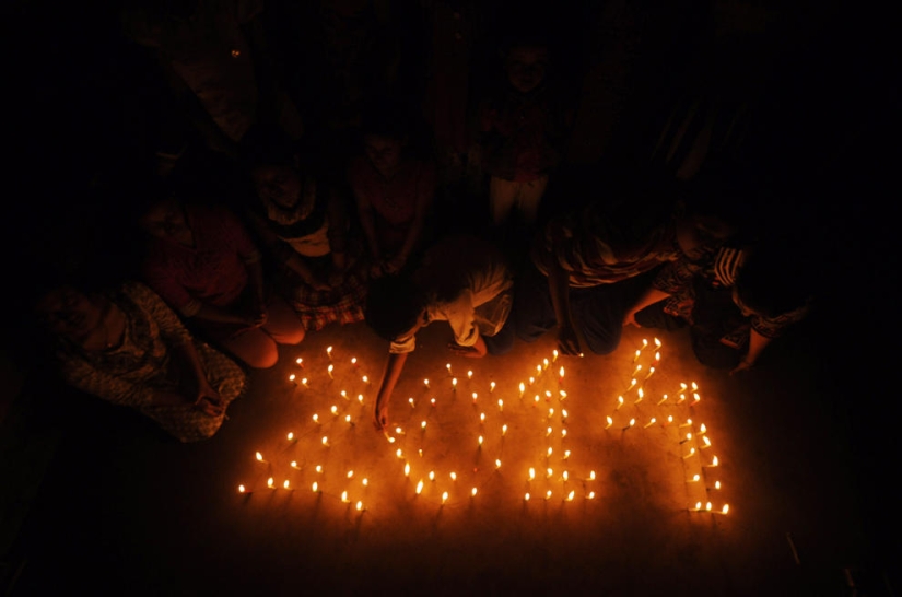 Fireworks, beaches and champagne - how the world met the new year 2014