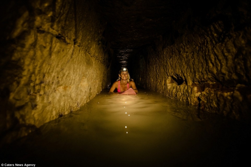 Indiana Jane: An American woman on a surfboard explores the skeletal catacombs of Paris
