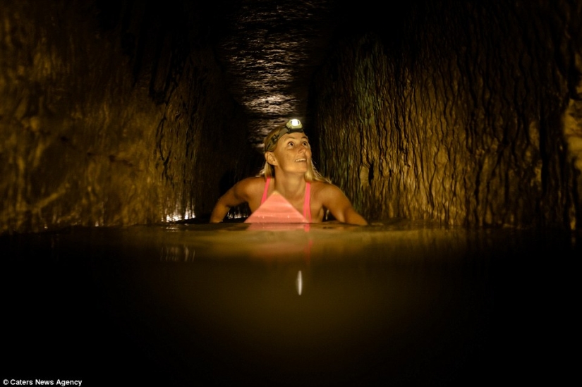 Indiana Jane: An American woman on a surfboard explores the skeletal catacombs of Paris