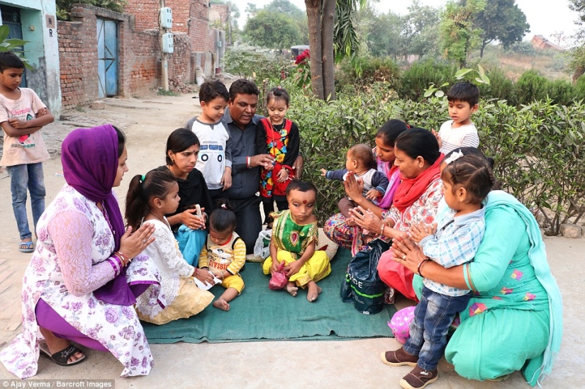 Residents of an Indian village worship a boy with a deformed head as the god Ganesha