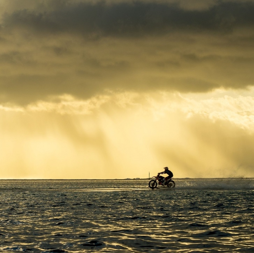 Surfing legend: Robbie Maddison rides a wave on a motorcycle