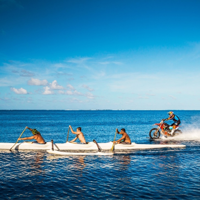 Surfing legend: Robbie Maddison rides a wave on a motorcycle