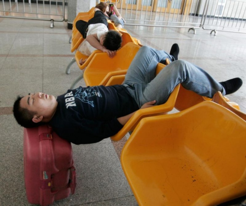 22 photos of people asleep in the most unexpected places