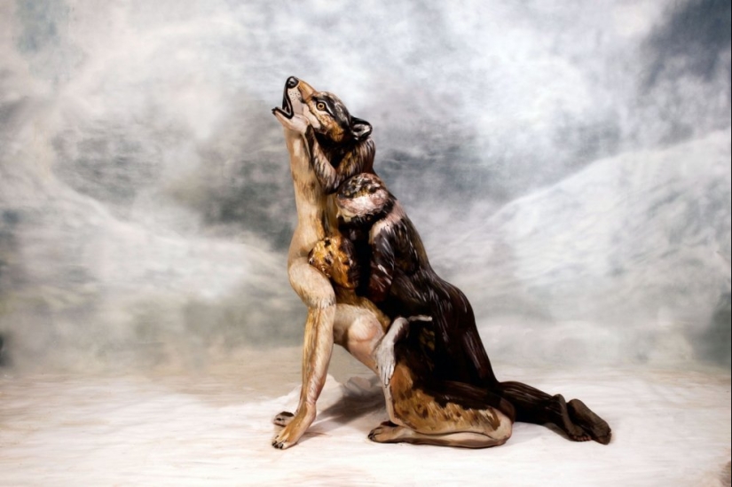 Can you find three naked women in this wolf photo?