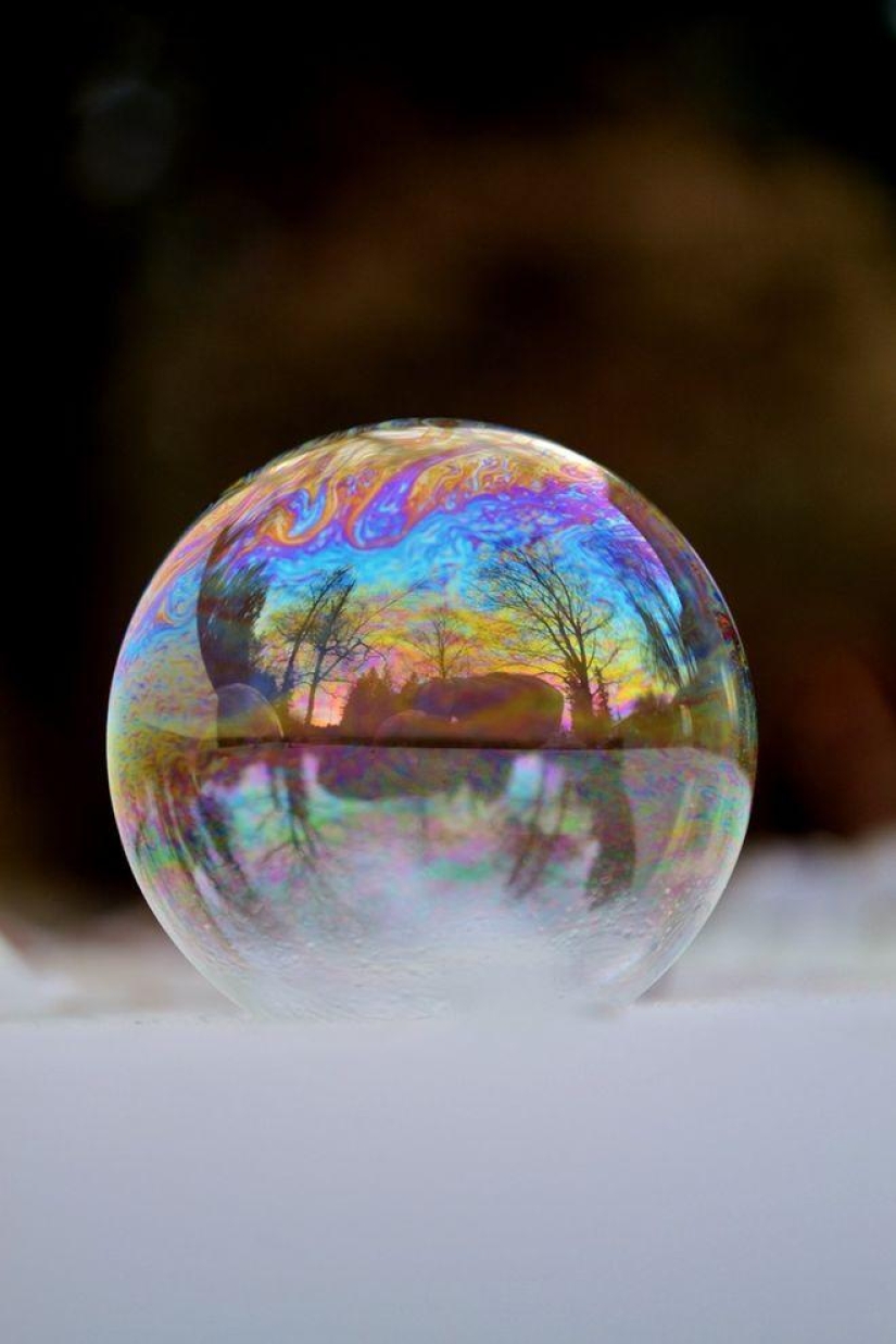 Crystal balls — a girl photographs soap bubbles in the cold Crystal balls — a girl photographs soap bubbles in the cold